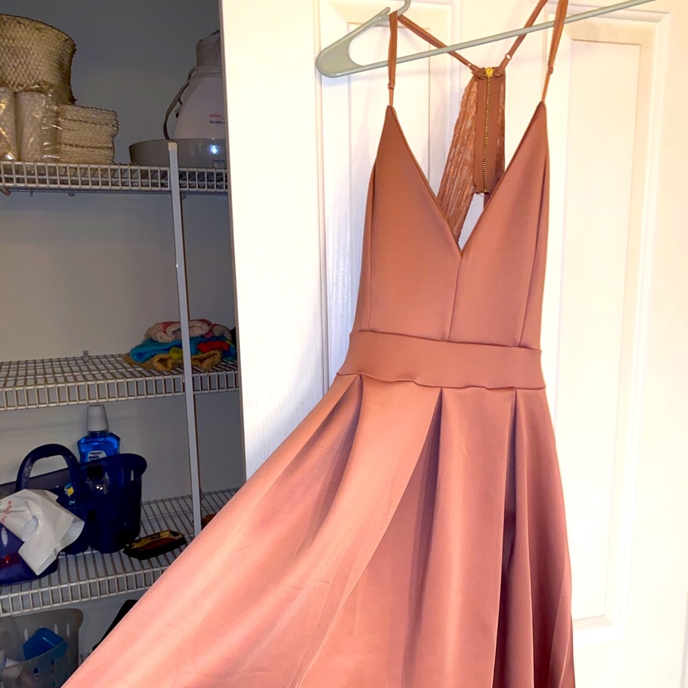 Formal flowing pink dress with lace backing